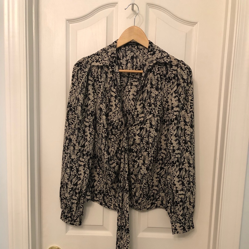 Long sleeve very soft material with tie in front. Size 6